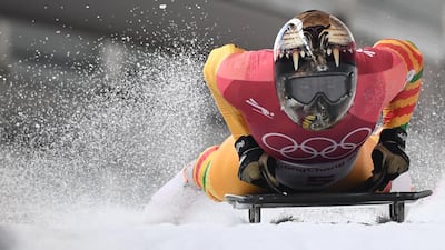 Ghana's Akwasi Frimpong slows down at the end of the mens' skeleton heat 1 during the Pyeongchang 2018 Winter Olympic Games. Mark Ralston / AFP
