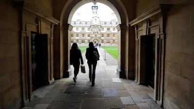 People walk into Cambridge University in eastern England. Reuters