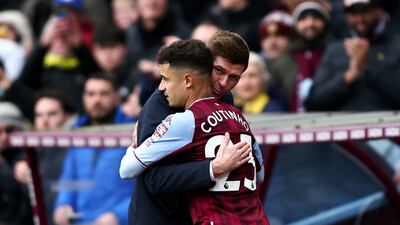 Philippe Coutinho is embraced by Villa manager Steven Gerrard after being substituted. Getty