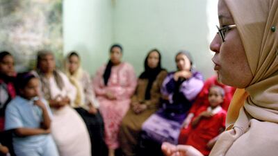 A counsellor tres to convince women they should not have female genital mutilation performed on their daughters in Minia, Egypt, in June 2006. Reuters