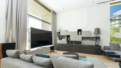 Greys and blues fill out the living space. Courtesy LuxuryProperty.com