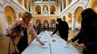 Security was tight with the government mobilising more than 50,000 police and gendarmes to protect polling stations, with an additional 7,000 soldiers on patrol. Here, voters are seen at a polling station in Lyon, France on April 23, 2017. Robert Pratta/Reuters