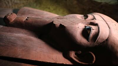 A wooden coffin inside the recently discovered burial site in Minya, Egypt. Mohamed Abd El Ghany / Reuters