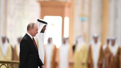 Russian President Vladimir Putin is received by Sheikh Mohamed bin Zayed during an official welcoming in Abu Dhabi. AFP
