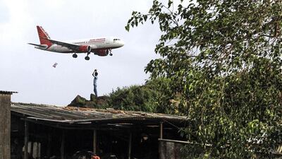 An Air India aircraft prepares to land at the airport in Mumbai. The airline posted a net loss of 55 billion rupees in the financial year to the end of March this year. Dhiraj Singh / Bloomberg