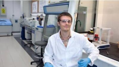 Physicist and a researcher Matt Martin, who studies the use of gold nanoparticles, pat the Khalifa University in Abu Dhabi. Silvia Razgova / The National