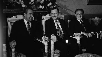 Richard Nixon, left, and Henry Kissinger, right, then US president and secretary of state, respectively, flank Syrian president Hafez Al Assad in Damascus, June 16, 1974