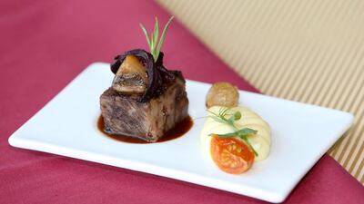 Braised beef short rib — we take whole piece of prime grass-fed Australian rib. It’s cooked, barely simmering, for 1.5 hours, until tender. Pawan Singh / The National