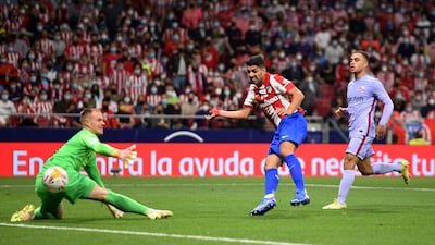 Luis Suarez of Atletico Madrid scores their team's second goal past Marc-Andre ter Stegen of FC Barcelona during the La Liga Santander match between Club Atletico de Madrid and FC Barcelona at Estadio Wanda Metropolitano. Getty Images