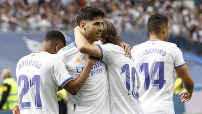Asensio celebrates with his teammates. EPA