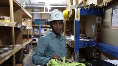Mahabub Shahidullah, from Bangladesh, at his new job as assistant store keeper with Kele Contracting in Dubai. Pawan Singh / The National