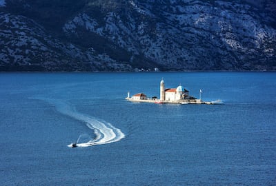 The Our Lady of the Rocks church sits on a small island in the Bay of Kotor. Getty