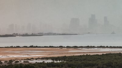 Abu Dhabi residents were greeted by showers and cloudy skies on Friday morning. The National