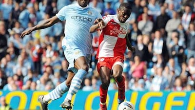 Mario Balotelli, left, has been hailed as the best Italian striker by Roberto Mancini. Peter Powell / EPA
