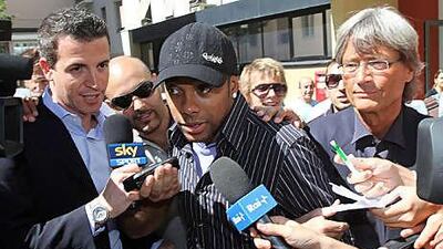 Robinho, centre, the Brazil forward, leaves the Sant' Antonio Abate hospital in Milan yesterday after completing his medical ahead of his move to AC Milan, the Serie A club, from Manchester City.