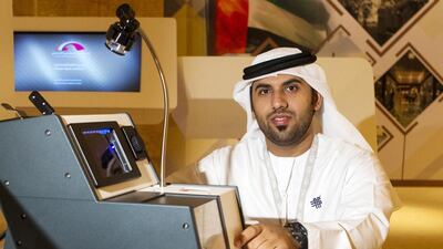 Emirati inventor Amer Al Jabri with his cost-effective 7E passport reading machine. Christopher Pike / The National