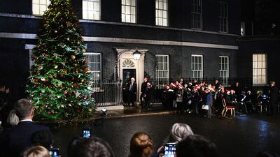 Boris Johnson switches on the Christmas tree lights outside 10 Downing Street in London, December 1. EPA