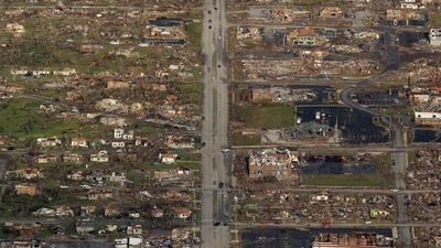 This May 24, 2011 file photo shows the path of a powerful tornado in Joplin, Mo. Nature is pummelling the United States in 2011 with extremes. There have been more than 700 U.S. disaster and weather deaths. What's happening, say experts, is mostly random ???
