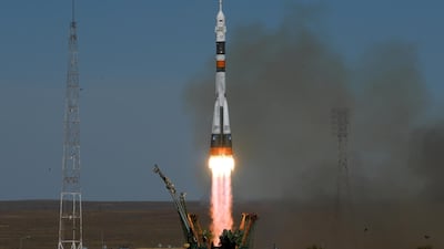 The Soyuz spacecraft carrying the members of the ISS expedition blasts off from the launch pad. AFP