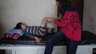 Sunmaya Tamang, a survivor of the April 25 earthquake, receives physiotherapy at a rehabilitation center in Kathmandu, Nepal. Niranjan Shrestha / AP Photo