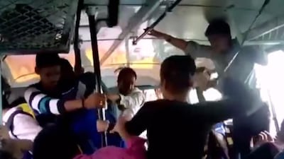 Screengrab of two Indian sisters attacking three of their alleged molesters on a moving bus. The video on Youtube sparked strong reactions in India.
