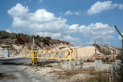 Structures set up by Israel separate Palestinian farmers from their land, with entrance only allowed by permit. Tanya Habjouqa / Noor for The National