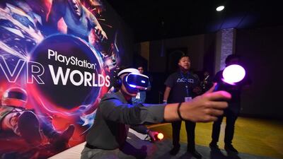 People try the new Sony VR headset at the Sony PlayStation E3 event at the Shrine Auditorium in Los Angeles, California, on June 13, 2016. Robyn Beck / AFP