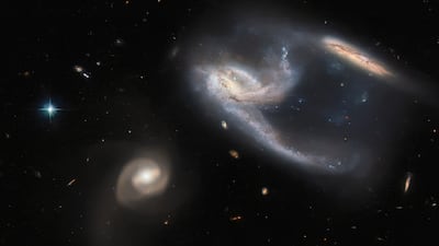 Rare image of three galaxies in one photo frame. Photo: Hubble Space Telescope / European Space Agency