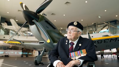 Norman Lewis, a 102-year-old Dunkirk veteran, next to the Spitfire. PA