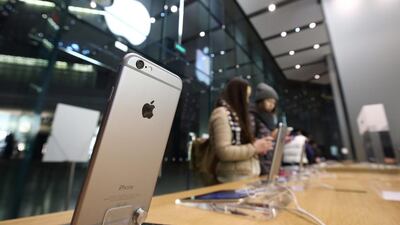 Customers try out an Apple iPhone 6 at an Apple store in the China Central Mall in Beijing. Tomohiro Ohsumi / Bloomberg