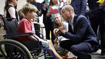Prince William speaks with Marco, a young Ukrainian, about his experience moving to Poland at an accommodation centre in Warsaw. Reuters