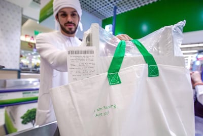 Rashid Awad checks out using reusable grocery bags at Lulu Hypermarket. Victor Besa / The National