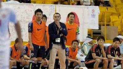 Japan's head coach Miguel Rodrigo watches his team in Dubai.