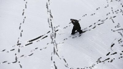 A person makes their way to Lambeau Field before an NFL football game between the Green Bay Packers and the Seattle Seahawks, in Green Bay, Wisconsin. Mike Roemer / AP Photo
