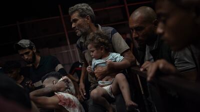 Palestinians injured in an Israeli strike east of Khan Younis arrive at the Nasser Hospital, in the southern Gaza Strip. EPA