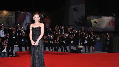 Winona Ryder in a black Dolce & Gabbana gown at the 'The Iceman' premiere during the 69th Venice Film Festival at the Palazzo del Cinema on August 30, 2012. Getty