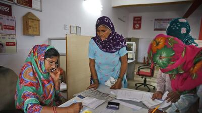 Sreeja Berwal, who is from the southern state of Kerala, works in a rural bank in the village of Sorkhi.