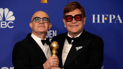 Bernie Taupin and Elton John pose with their awards for Best Original Song - Motion Picture for 'I'm Gonna Love Me Again,' from 'Rocketman' during the 77th annual Golden Globe Awards on January 5, 2020, at The Beverly Hilton hotel in Beverly Hills, California. Reuters