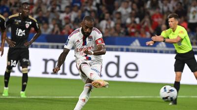 Lyon's French forward Alexandre Lacazette kicks to score his team's second goal on a penalty during the French Ligue 1 football match between Olympique Lyonnais (OL) and Ajaccio at The Groupama Stadium in Decines-Charpieu, central-eastern France, on August 5, 2022. (Photo by JEAN-PHILIPPE KSIAZEK / AFP)
