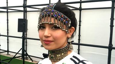 A visitor to Fashion Forward Season 9 wears a beaded headpiece from her native Afghanistan. Courtesy Rebecca McLaughlin Duane