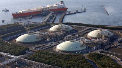 Liquefied natural gas (LNG) storage tanks and a membrane-type tanker are seen at Tokyo Electric Power Co’s Futtsu Thermal Power Station in Futtsu, east of Tokyo. Issei Kato / Reuters
