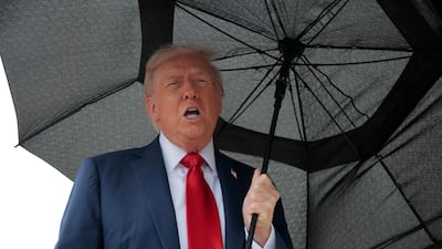 US President Donald Trump speaks to the press before boarding Air Force One for a trip to the Middle East on Sunday. AFP