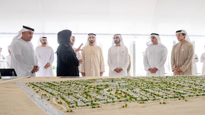 Sheikh Mohammed bin Rashid, Vice President and Ruler of Dubai, looks over plans for a housing development for Emiratis in Ras Al Khaimah in February. Courtesy Dubai Media Office