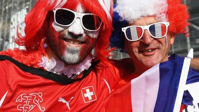 Fans from France and Switzerland pose for a picture ahead of the Group A game. Shaun Botterill / Getty Images