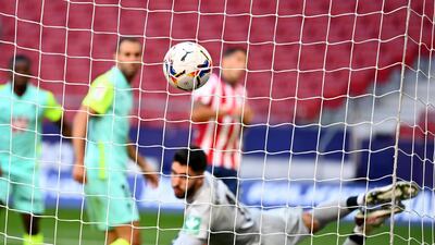 Granada goalkeeper Rui Silva watches the ball hit the net after Luis Suarez's shot. AFP