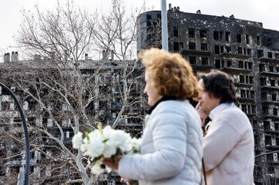 Mourners gathered outside Valencia's City Hall on Saturday for a moment of silence for the victims of the blaze. EPA