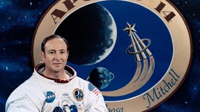 Apollo 14 astronaut Edgar Mitchell posing in front of the mission's patch. Nasa