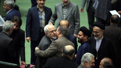 Iranian MPs greet Iranian foreign minister Mohammad Javad Zarif after sanctions were lifted under Tehran's nuclear deal with world powers. (Atta Kenare / AFP)