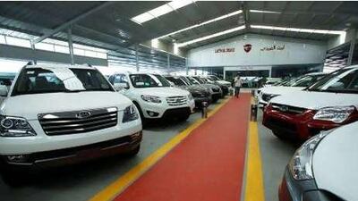 New cars displayed in the free zone near Zarqa.