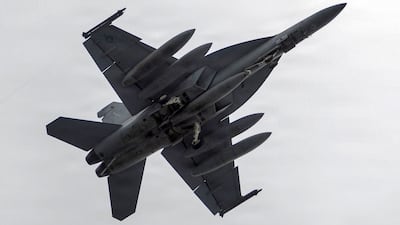 An F/A-18 Super Hornet prepares to land aboard Nimitz-class aircraft carrier USS George Washington last month. US Navy / AFP